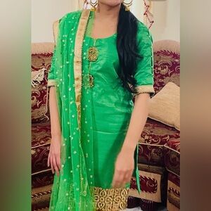 Bright green three piece Indian suit
